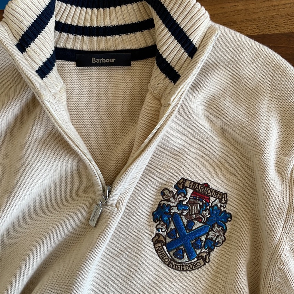 Men’s cream Barbour half zip sweater.
